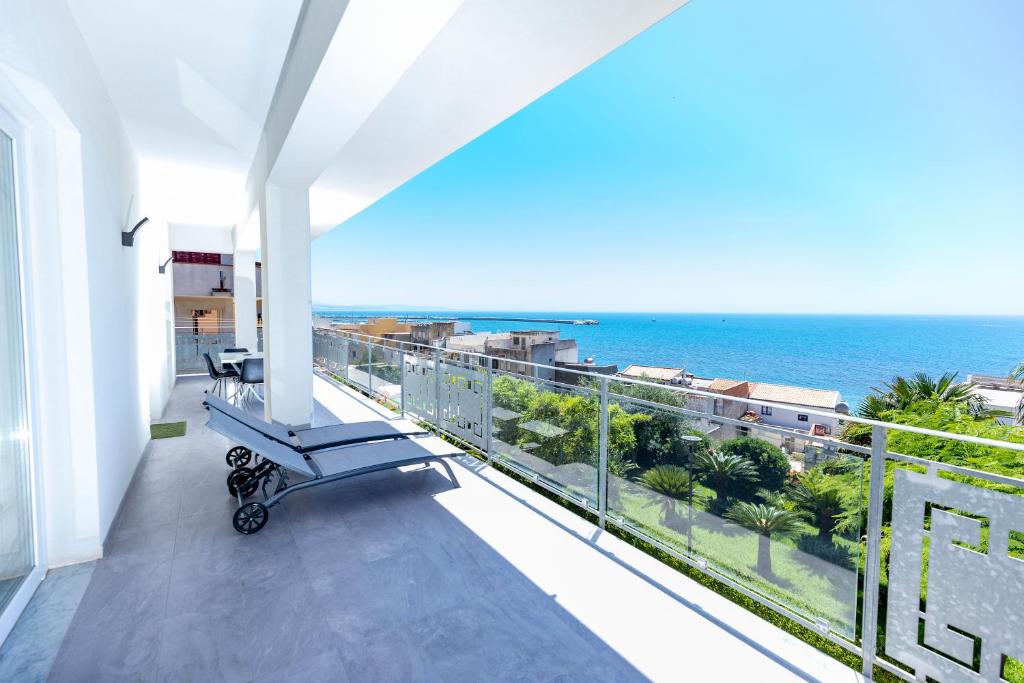 a balcony with a view of the ocean at Casa vacanza lido in Sciacca