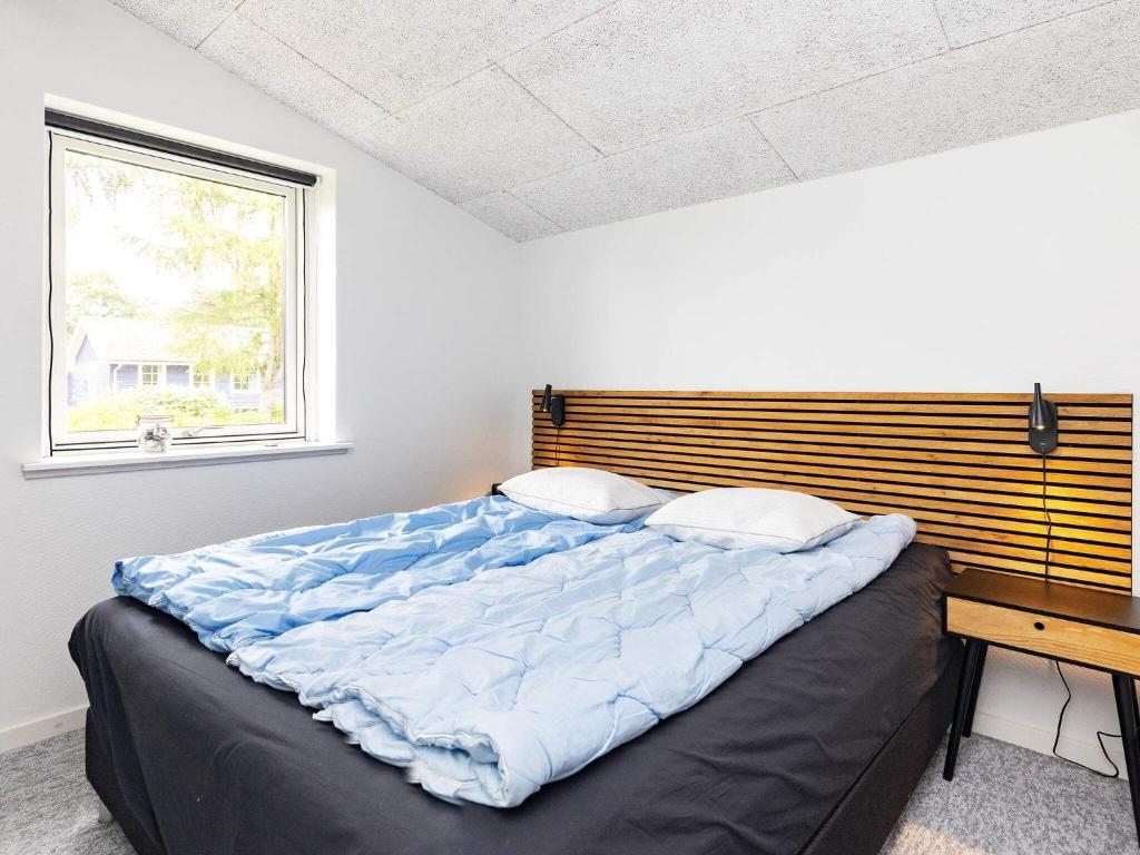 Postel nebo postele na pokoji v ubytování Holiday home Otterup XII