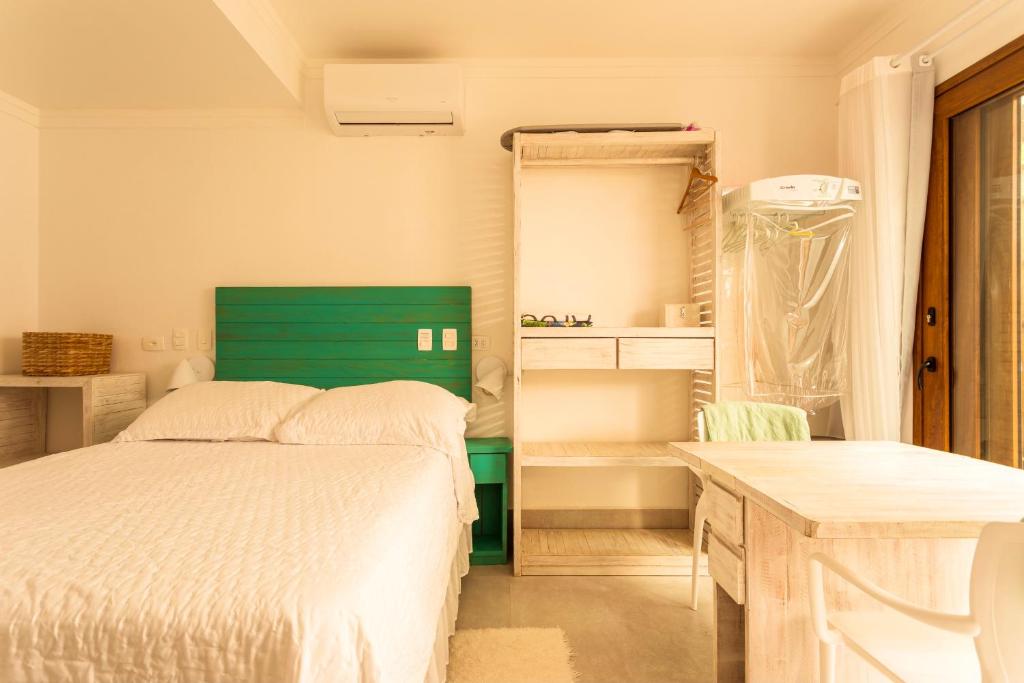 Casa d'Aroeira Condomínio Luxo - Centro de Juqueí - 2 quadras do mar - Serviço de Praia - Roupa de Cama 600 fios algodão Egípcio - Toalhas Banho e Praia - Tudo Novo - Estacionamento - Cozinha completa - Consulte unidades com Ofurô Hidro e Cromoterapia - Studio With Balcony