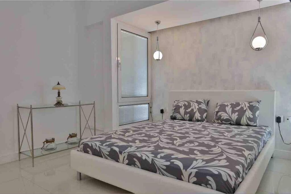 Postel nebo postele na pokoji v ubytování Soi's Apartment II