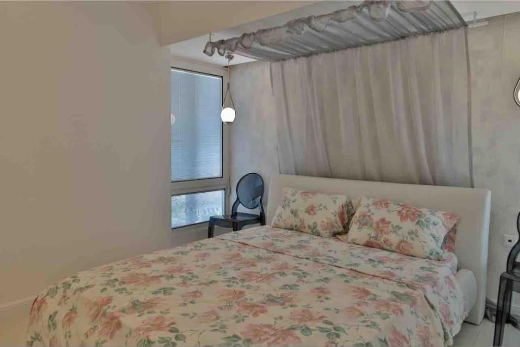 Postel nebo postele na pokoji v ubytování Soi's Apartment II