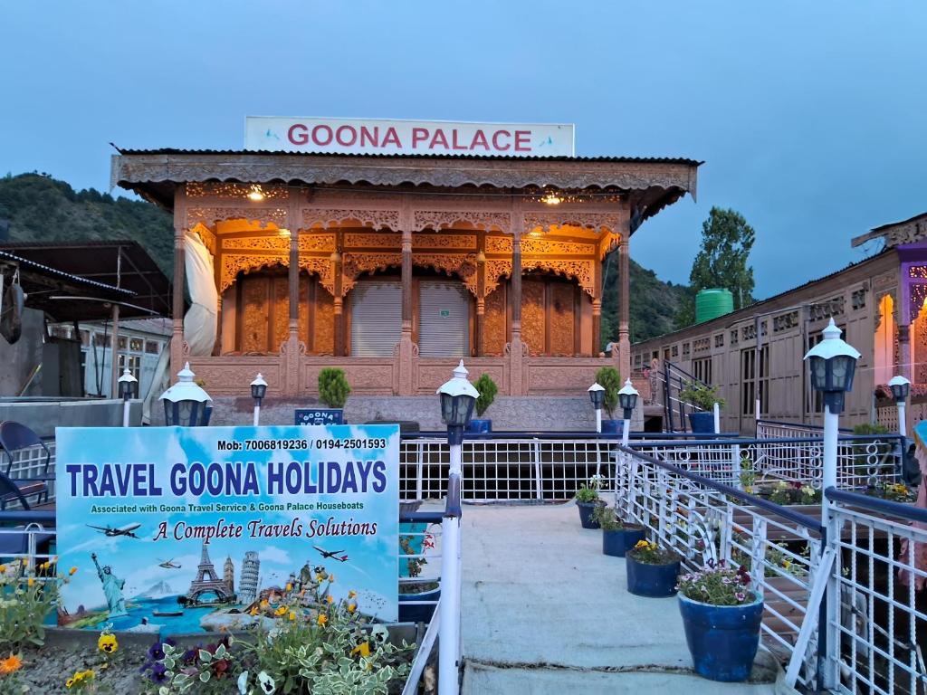 a welcome sign in front of a building at Goona palace houseboats in Srinagar