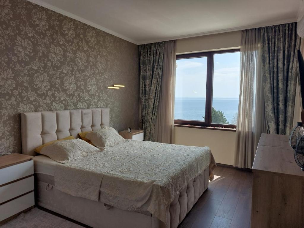 Luxury SeaView Penthouse Apartments at Valencia Gardens tesisinde bir odada yatak veya yataklar