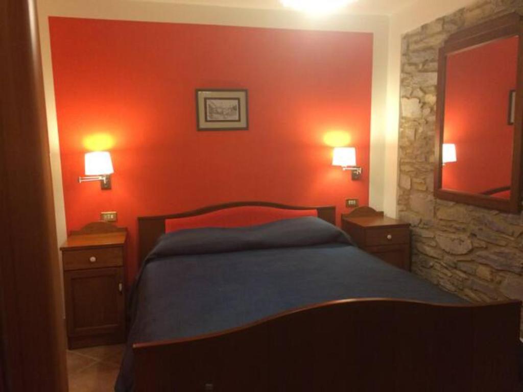 Postel nebo postele na pokoji v ubytování Albergo Miramonti