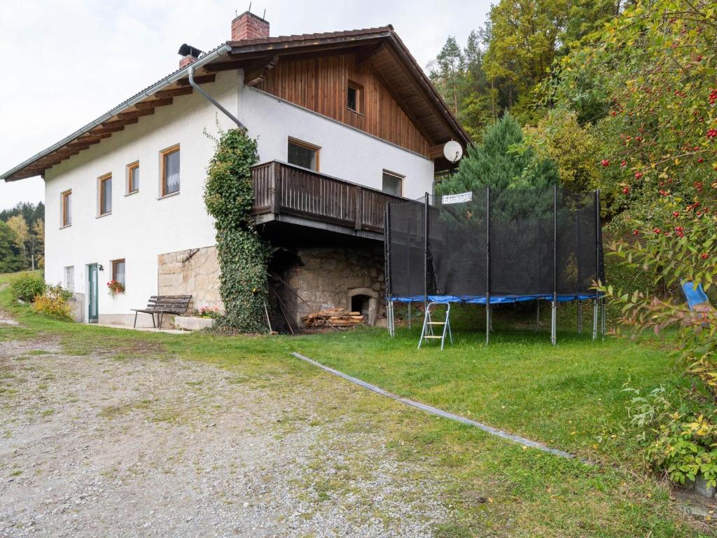 a house with a fence in front of it at Beautiful holiday home in Viechtach with views in Viechtach