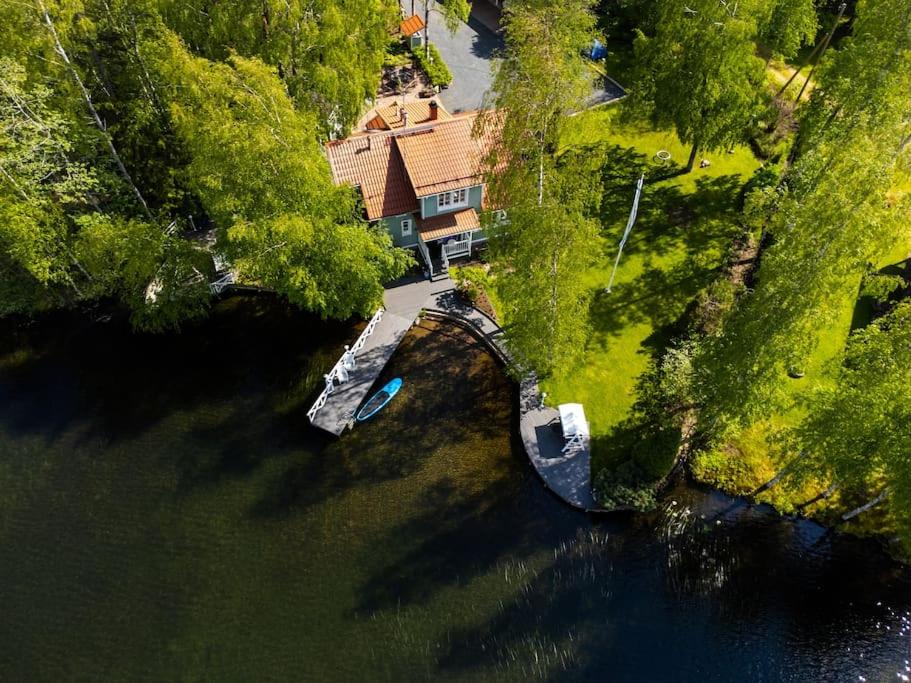 an aerial view of a house in the middle of a river at Villa Kesätie - Lakeside Paradise in Nurmijärvi