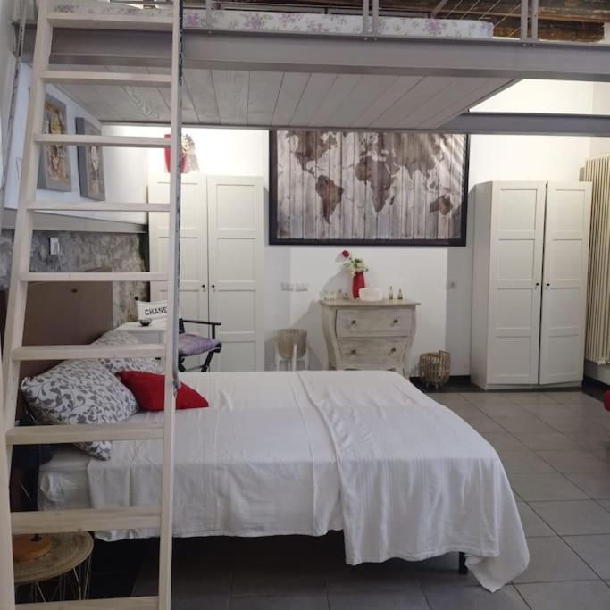 a bedroom with a bunk bed and a ladder at casavera in Como