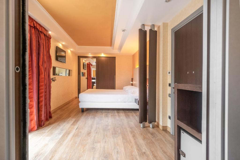 Postel nebo postele na pokoji v ubytování Kriss Internazionale Hotel