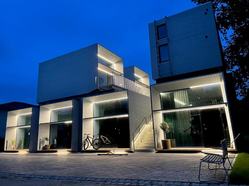 a large white building with a lot of windows at Chalet Park by Maier Höchst in Höchst