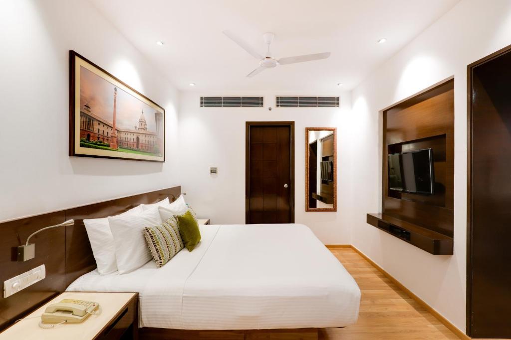 Postel nebo postele na pokoji v ubytování Lemon Tree Premier 1, Gurugram