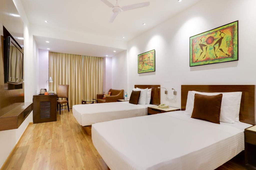 Postel nebo postele na pokoji v ubytování Lemon Tree Premier 1, Gurugram