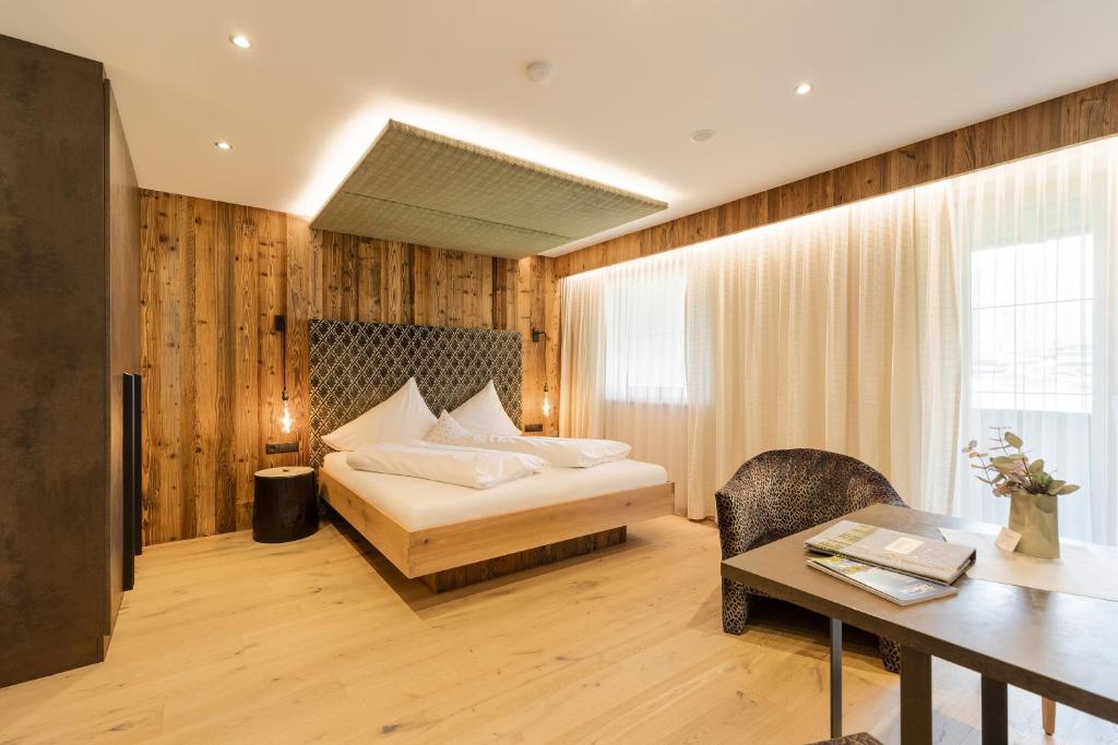 Postel nebo postele na pokoji v ubytování Hotel Garni Jagdhof