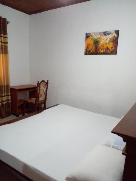 Postel nebo postele na pokoji v ubytování Muthu Villa Sri Lanka