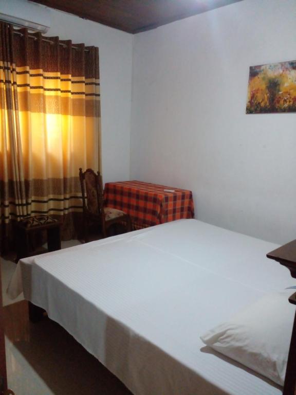 Postel nebo postele na pokoji v ubytování Muthu Villa Sri Lanka