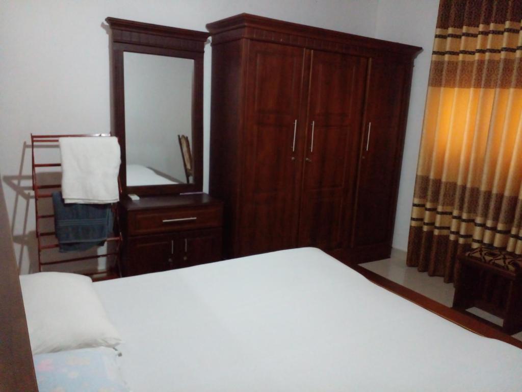 Postel nebo postele na pokoji v ubytování Muthu Villa Sri Lanka