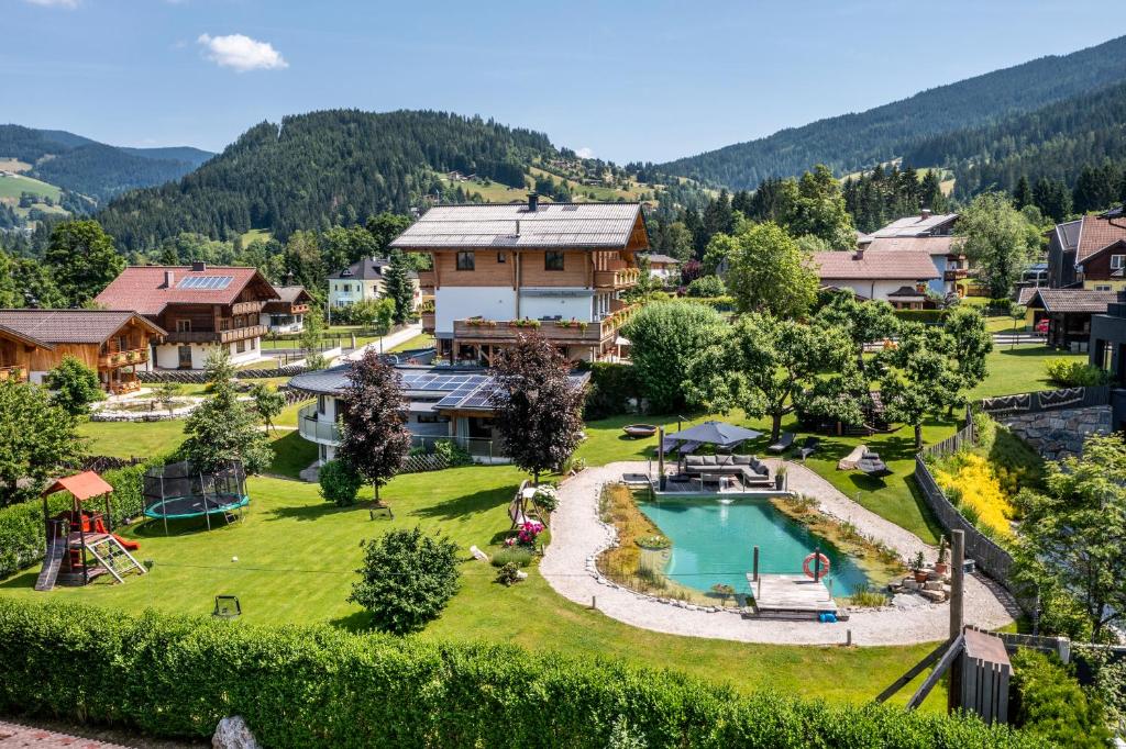an aerial view of a resort with a swimming pool at Landhaus Rustika in Wagrain