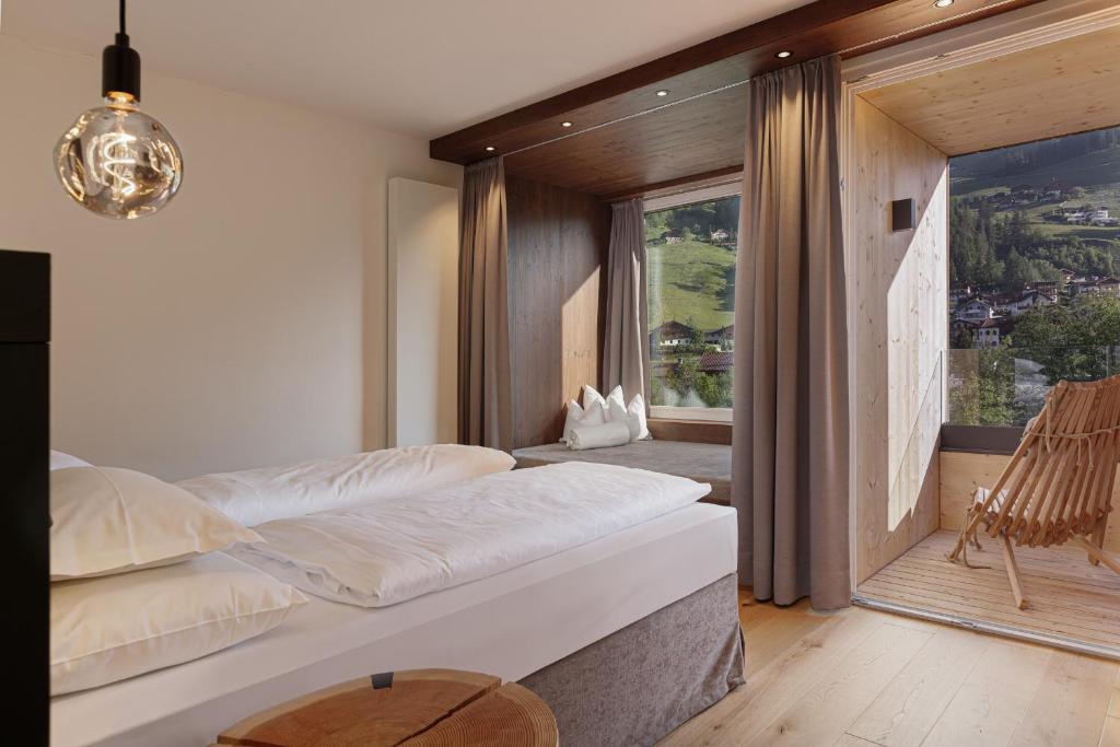 Postel nebo postele na pokoji v ubytování Alpine Life Hotel Anabel