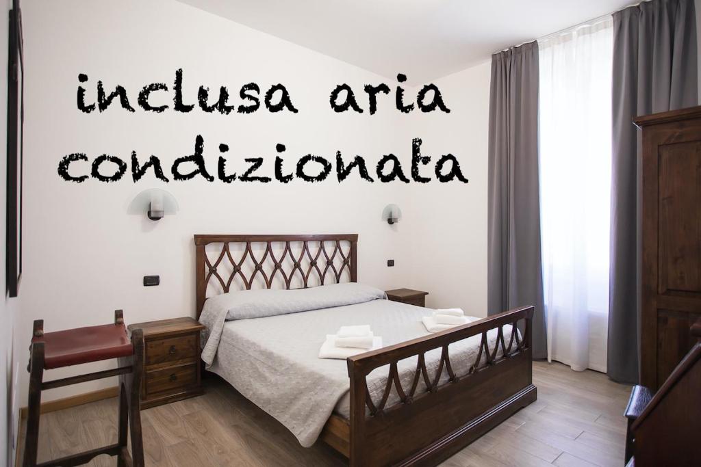 Postel nebo postele na pokoji v ubytování Hotel Amico