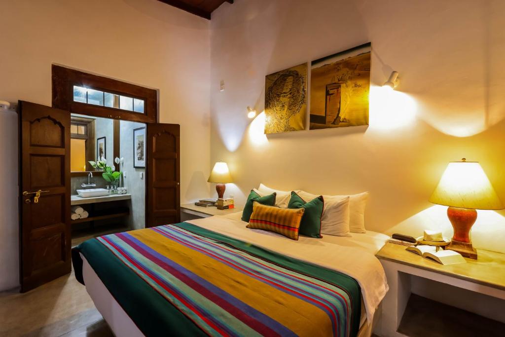Postel nebo postele na pokoji v ubytování Margossa Residence Kandy