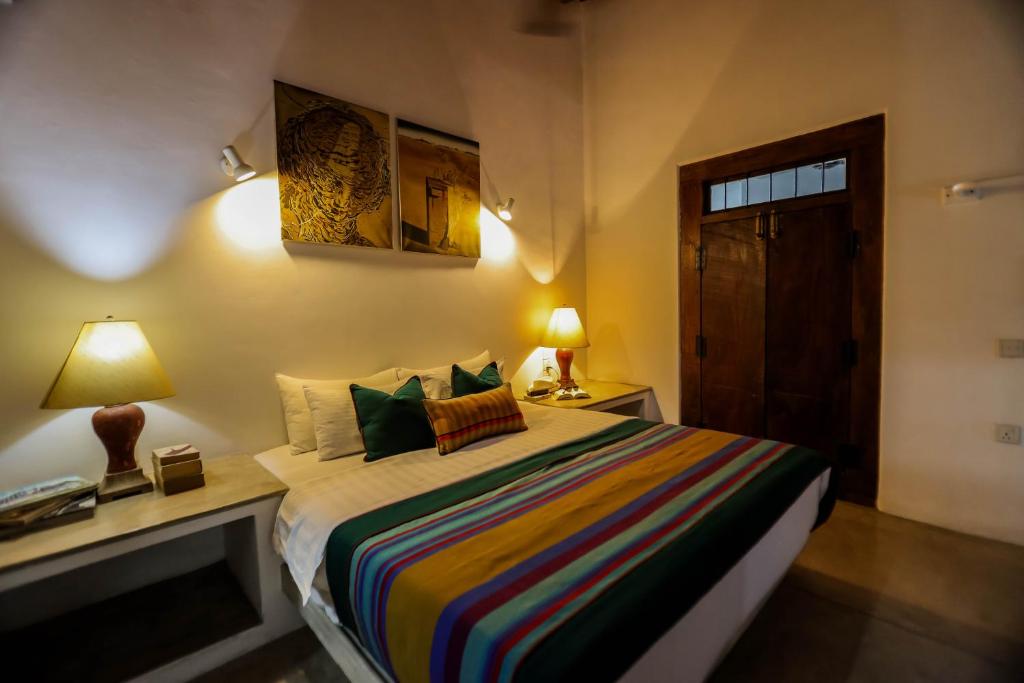 Postel nebo postele na pokoji v ubytování Margossa Residence Kandy
