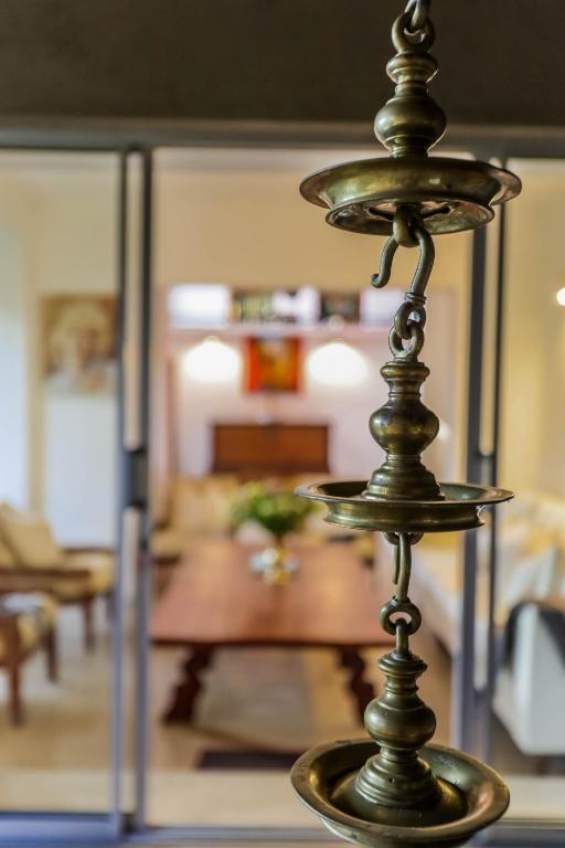 Postel nebo postele na pokoji v ubytování Margossa Residence Kandy