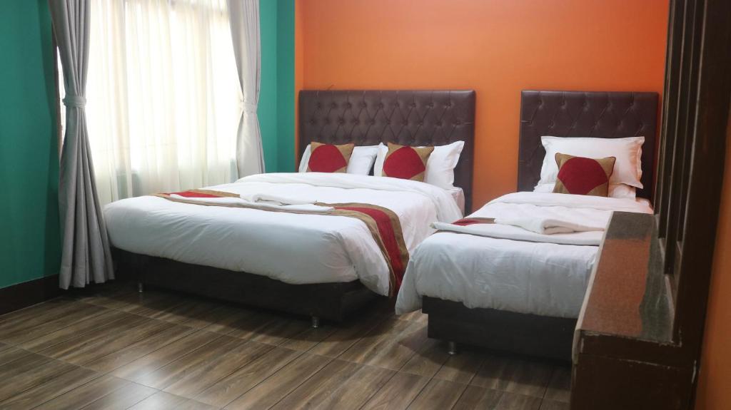Postel nebo postele na pokoji v ubytování Nepalaya Home Hostel