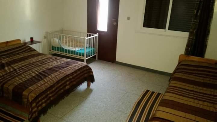 En eller flere senge i et værelse på ESCAPADE Assilah