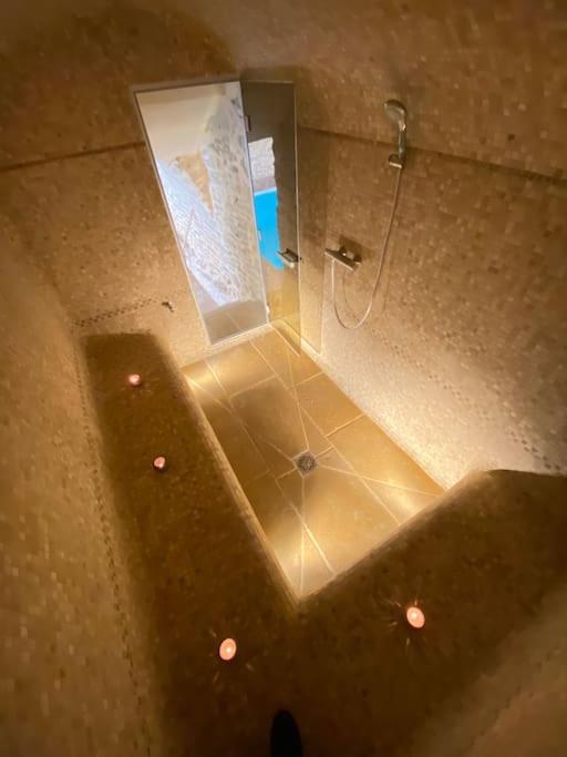 an overhead view of a bathroom with a shower at Gîte de la corgette in Saint-Romain