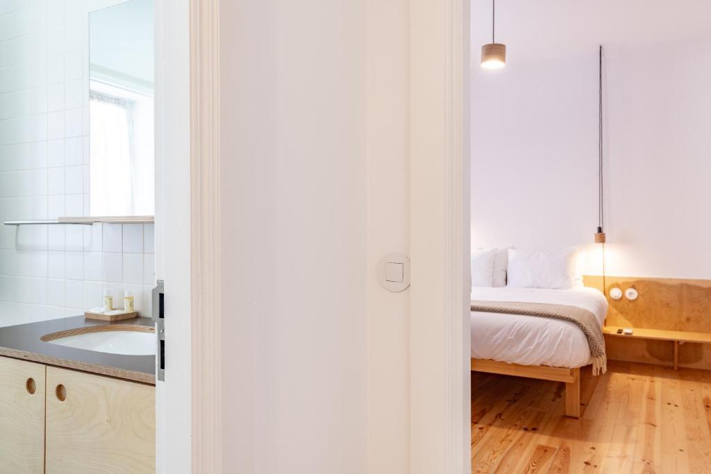 Postel nebo postele na pokoji v ubytování Quinta do Calvário