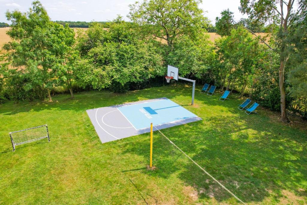 an overhead view of a basketball hoop in a field at Crazy Villa Champs Corons 61 - Interior heated pool - 2h from Paris - 30p in Les Menus