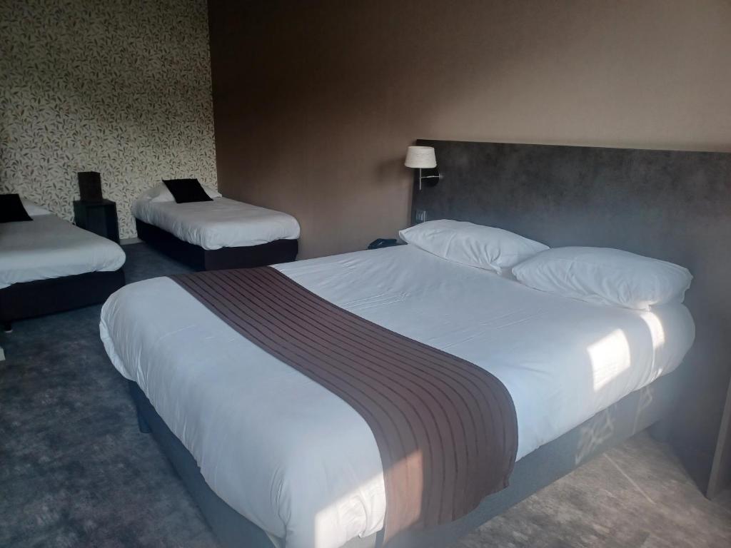 Postel nebo postele na pokoji v ubytování Hôtel La Parenthèse
