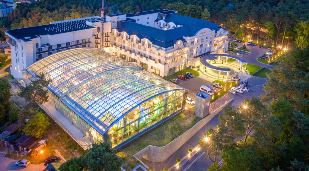 an overhead view of a building with a glass greenhouse at Hotel Binkowski in Kielce