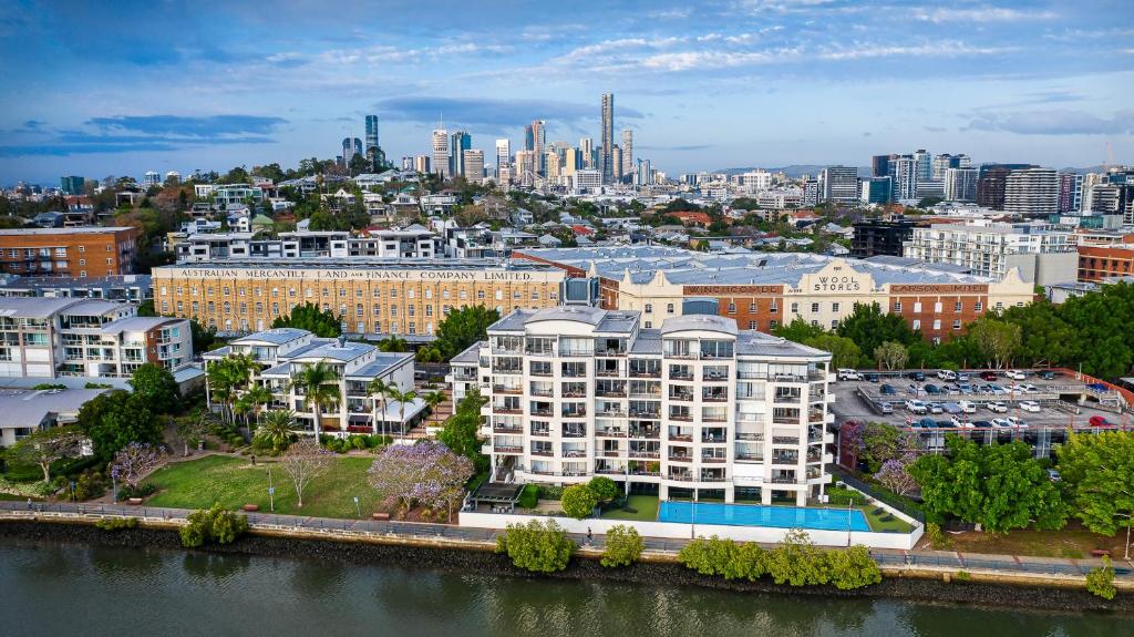 an aerial view of a city with a river and buildings at Goldsborough Place Apartments in Brisbane
