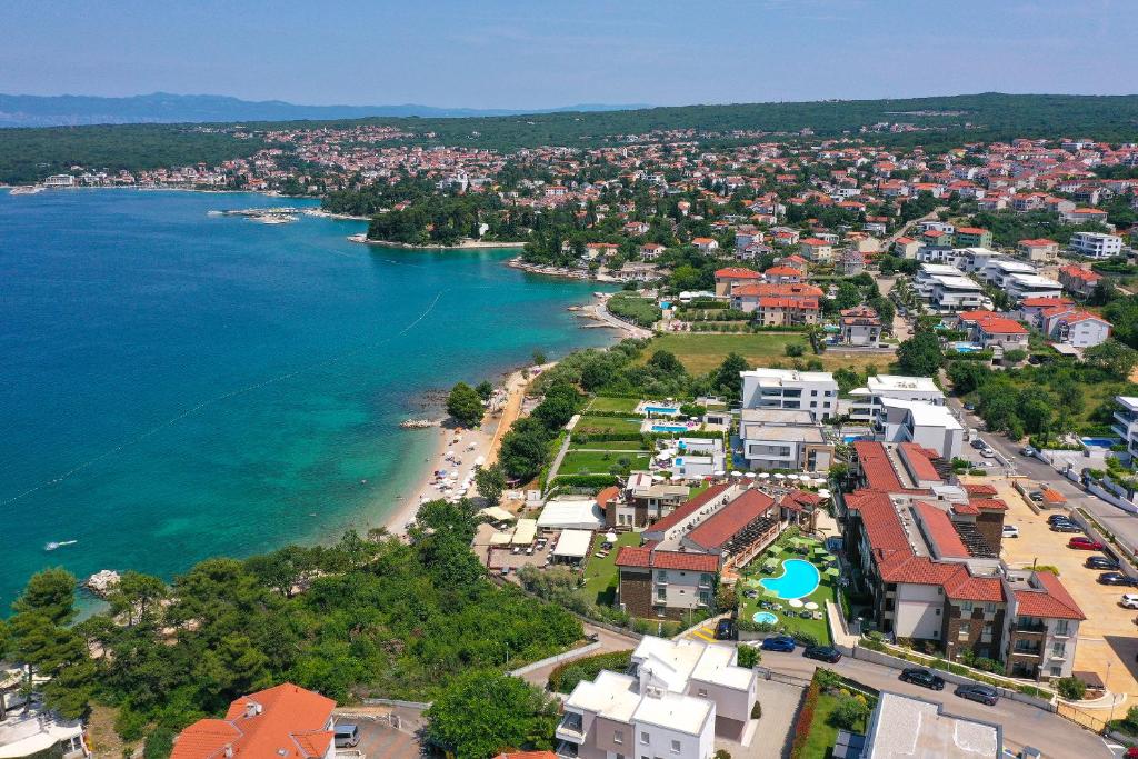 an aerial view of a town next to a body of water at Blue Waves Resort in Malinska