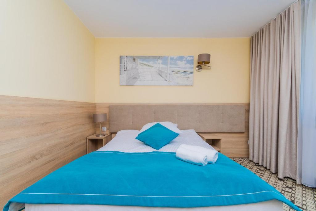 Postel nebo postele na pokoji v ubytování Sanatorium Zefir