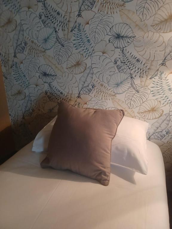 Postel nebo postele na pokoji v ubytování Hôtel La Parenthèse