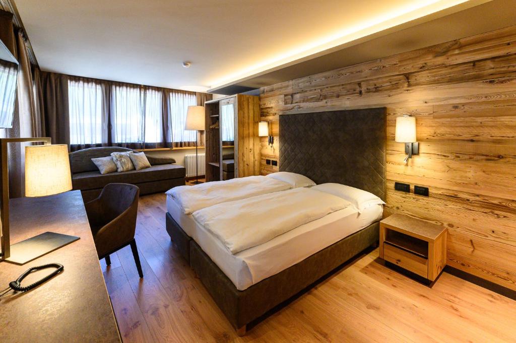 Postel nebo postele na pokoji v ubytování Hotel Crozzon