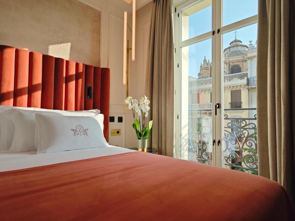 Postel nebo postele na pokoji v ubytování Palacio Gran Vía, a Royal Hideaway Hotel