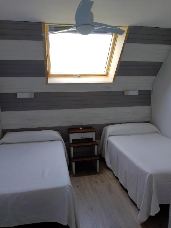 Postel nebo postele na pokoji v ubytování Apartamentos Viña Olivan