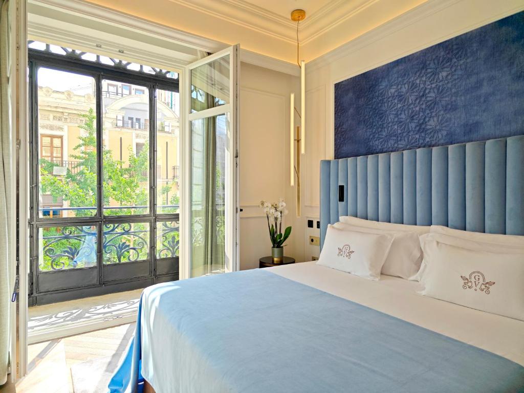 Postel nebo postele na pokoji v ubytování Palacio Gran Vía, a Royal Hideaway Hotel
