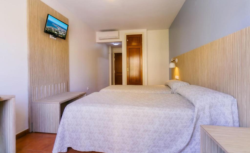 Posteľ alebo postele v izbe v ubytovaní Hotel Galicia