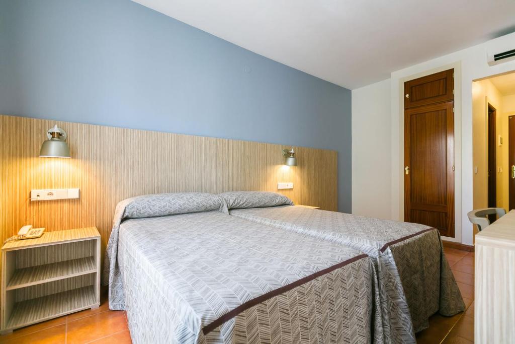 Posteľ alebo postele v izbe v ubytovaní Hotel Galicia