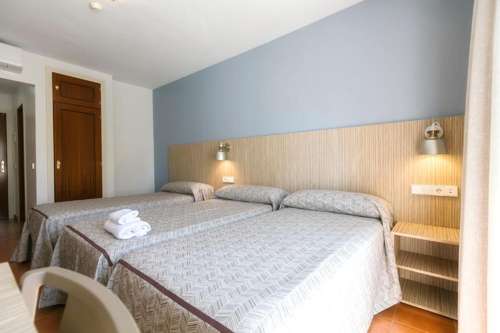 Posteľ alebo postele v izbe v ubytovaní Hotel Galicia