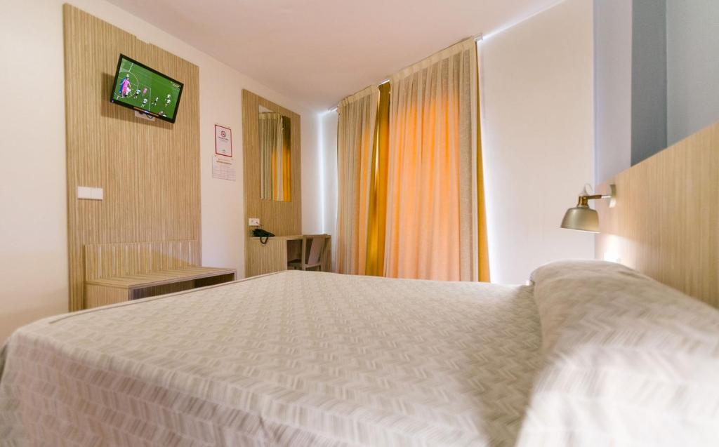 Posteľ alebo postele v izbe v ubytovaní Hotel Galicia