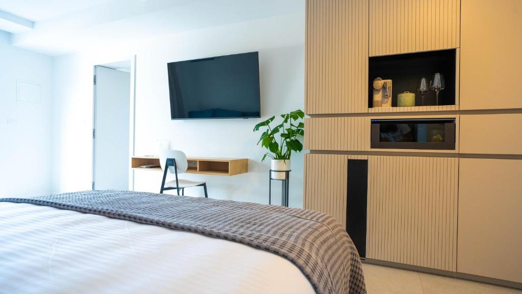 TV a/nebo společenská místnost v ubytování Maravida Vacation Rooms