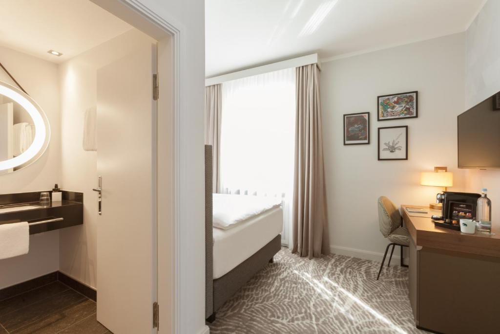 Ένα ή περισσότερα κρεβάτια σε δωμάτιο στο Hotel Elephant Weimar, Autograph Collection