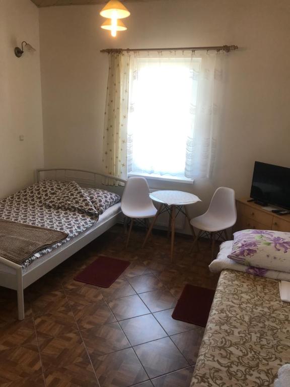 Postel nebo postele na pokoji v ubytování Dom Jana
