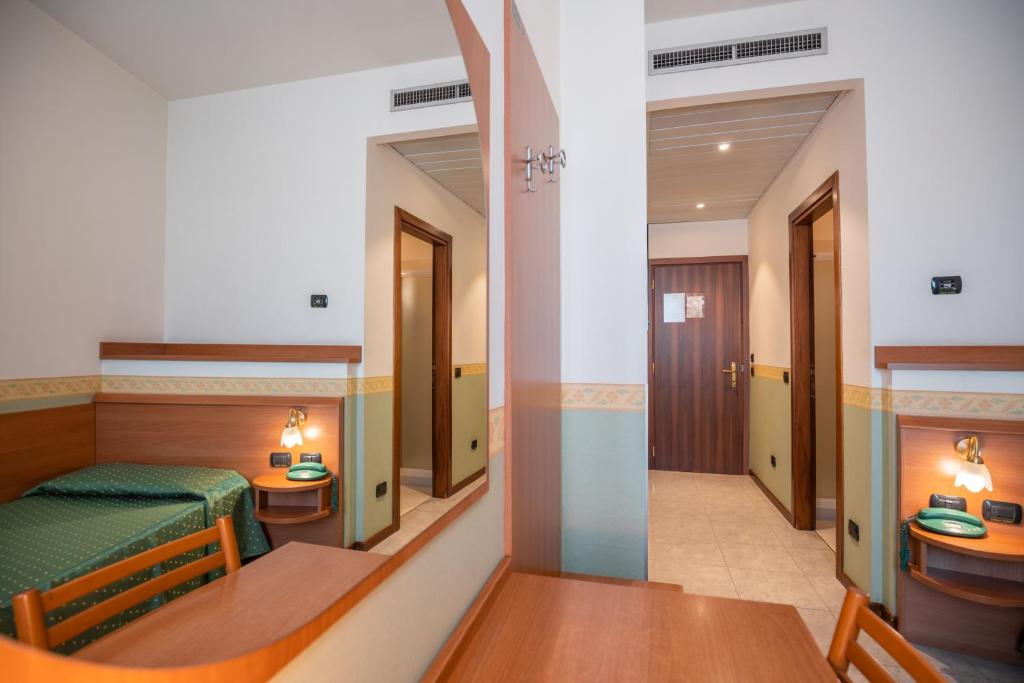 Łóżko lub łóżka w pokoju w obiekcie Hotel Stadio & Spa