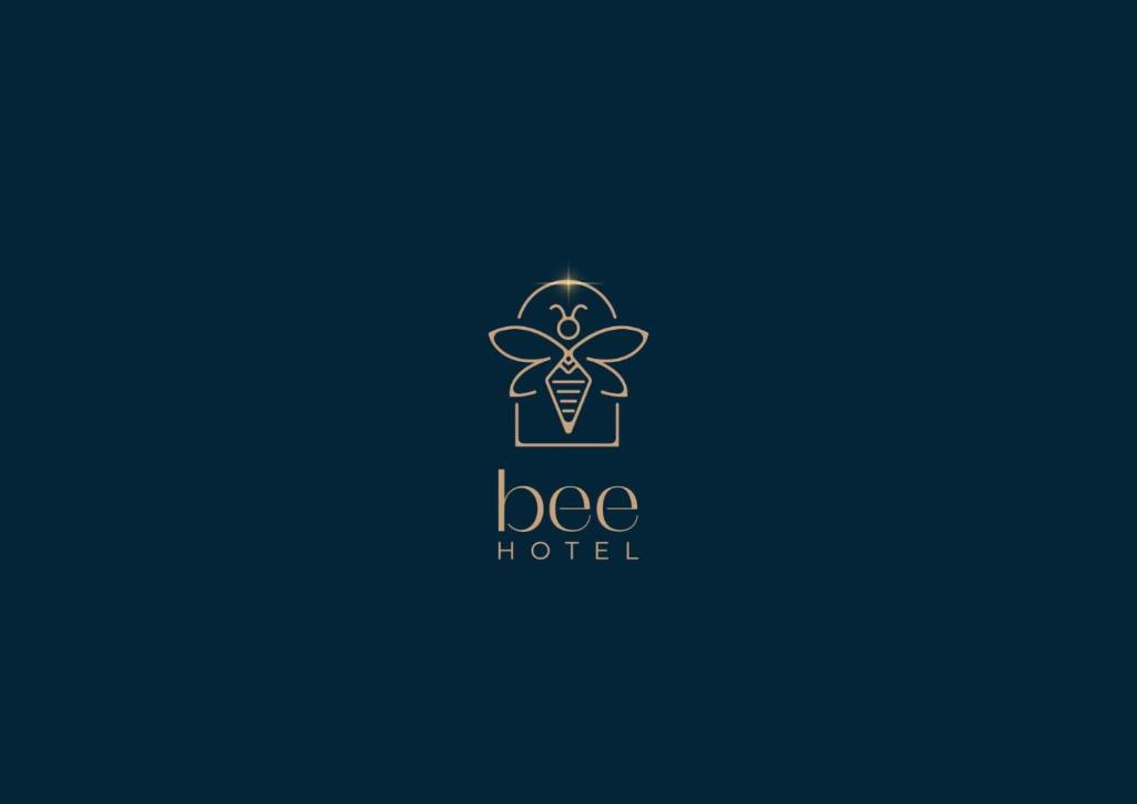 a logo for a bee hotel at Bee Hotel in Vlorë