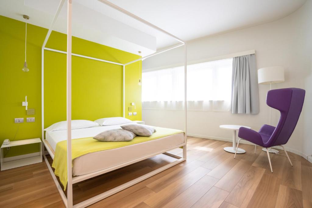 Łóżko lub łóżka w pokoju w obiekcie Hotel Stadio & Spa